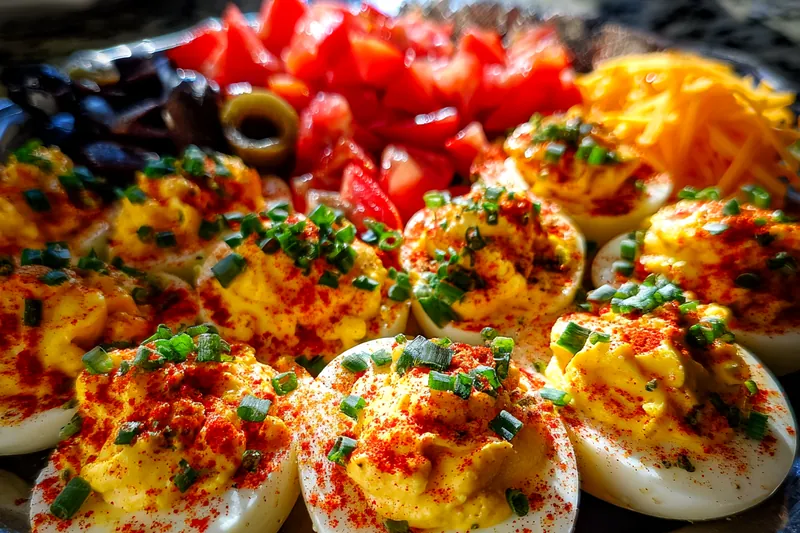 The process of boiling eggs for deviled eggs, showing a pot on the stove with eggs inside.