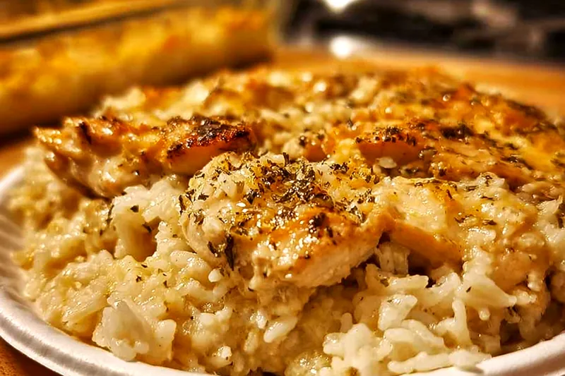 Golden chicken bites sizzling in a skillet with melted butter and garlic, showing the perfect searing technique and aromatic steam rising
