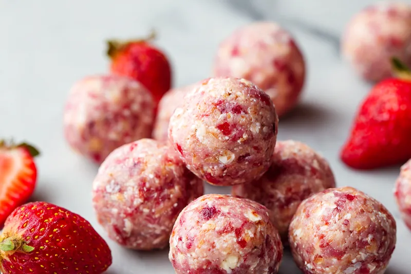 Fresh ingredients for no-bake strawberry cheesecake protein balls