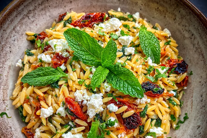 A skillet with sautéed vegetables for the Orzo Veggie Breakfast Bowl, showcasing bright colors and textures.